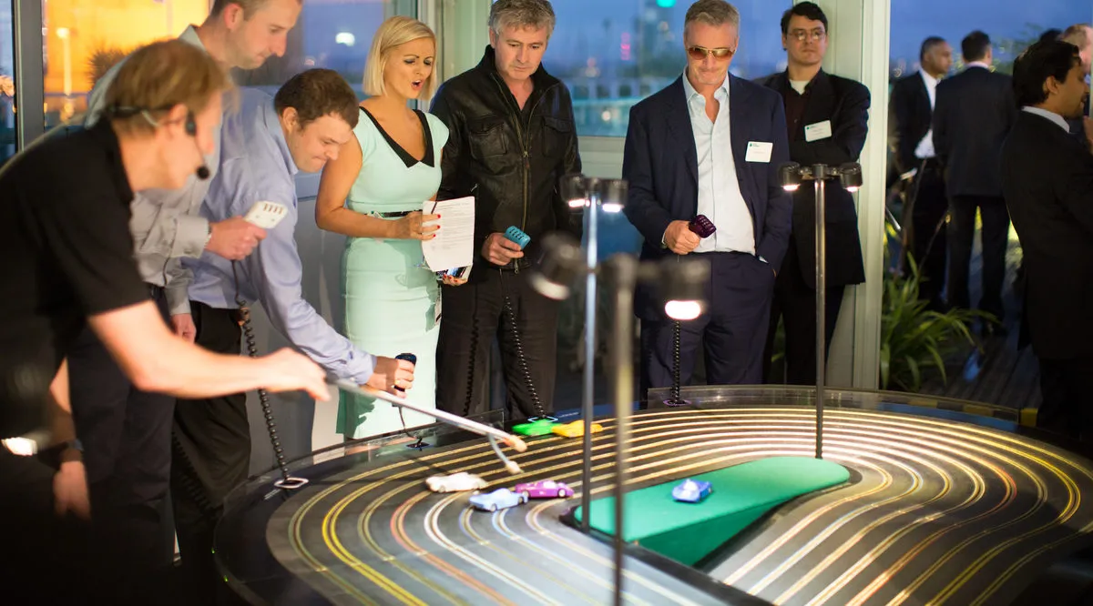 scalextic events hire events ideas miniracing.com Giant Scalextric 8 lane track for hire being played at an exhibition event